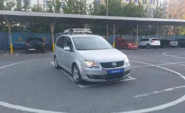 Volkswagen Touran 2009 года за 4 500 000 тг. в Алматы фото 2