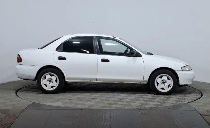 Mazda Familia 1997 года за 850 000 тг. в Астана фото 4