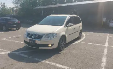 Volkswagen Touran 2010 года за 4 000 000 тг. в Алматы фото 1